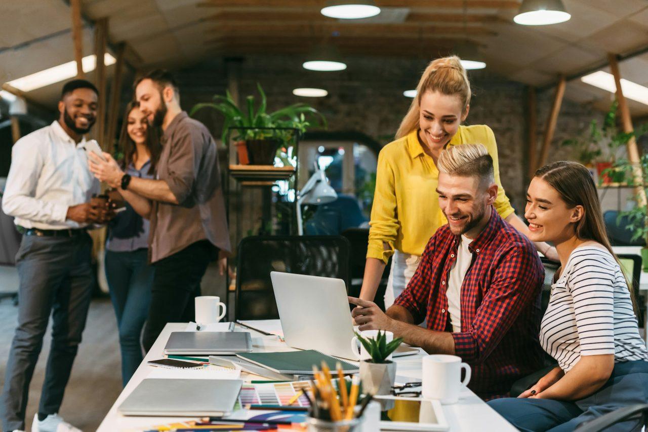 young web designers working together at modern office 1